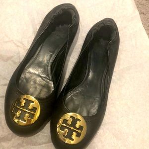 Tory and Burch black flats with gold logo.